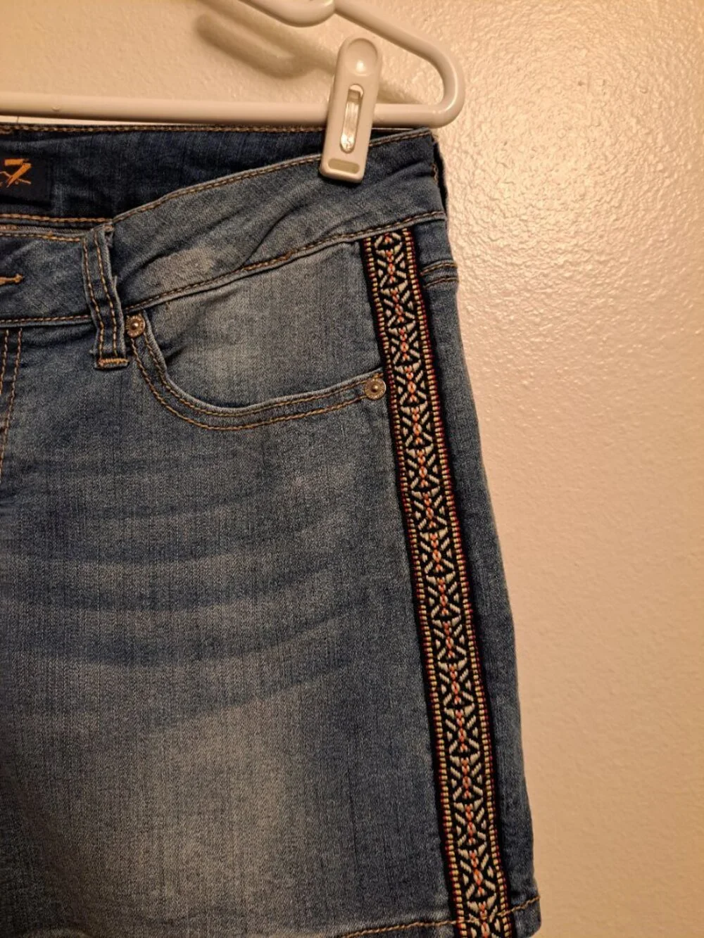 Seven7 Boho denim shorts featuring distinctive embroidered side detailing